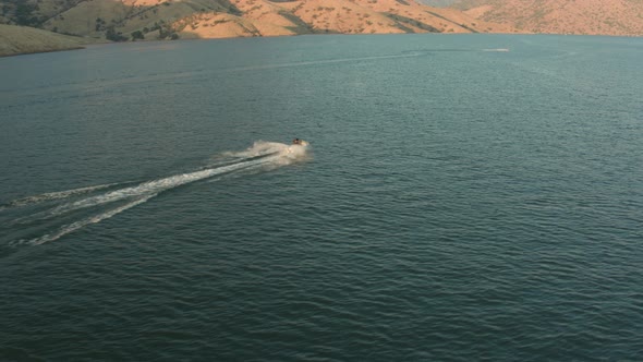 Aerial Drone Tracking Shot of a Personal Watercraft on a Mountain Lake (Lake Kaweah, Visalia, CA)