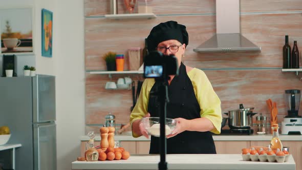 Senior Baker Speaking About Flour alt