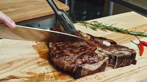 Grilled Beef Pork Meat Steak Fillet with Asparagus Hot Red Peppers and Cutlery on Wooden Cutting