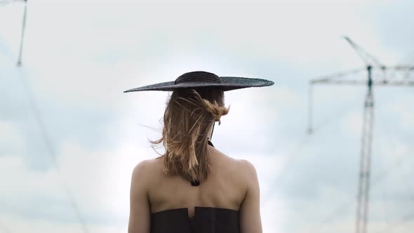Back Of Girl With Long Hair. Wind Moves Her Bair. alt