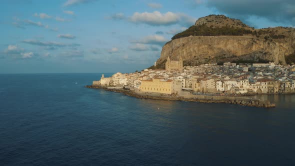 Drone shot of Cefalu during sunset in Island of Sicily Italy 4K