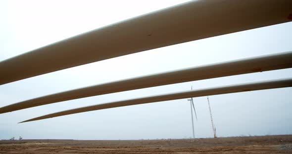 Panoramic View From Under the Wind Turbine Blades on Support Structures alt