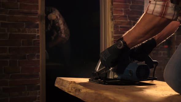 Close Up Shot of a Man's Hands Who Works with a Carpentry Tool in His Workshop alt