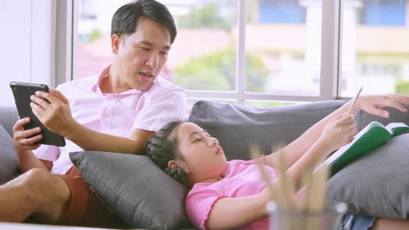 Happy family with father and daughter spending time together at home. alt