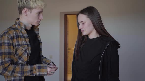 The Young Woman Gives the Pregnancy Test To Man, He Throws It Away alt