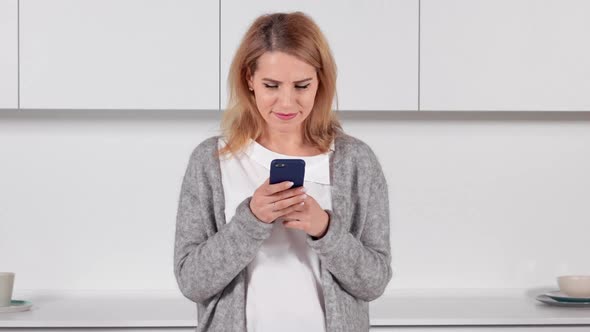 Portrait Middle Aged Female with Mobile Indoors alt