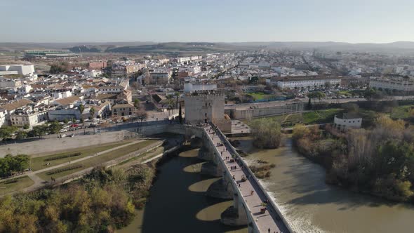 Aerial view of historic center of Cordoba with ancient Roman Bridge over Guadalquivir river in Spain