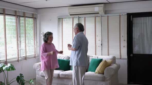 Senior man and woman dancing happy alt
