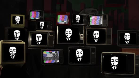 Guy Fawkes Masks on Retro TV Stack. alt