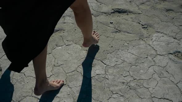 Moving Image of Women's Feet Walking on the Sand