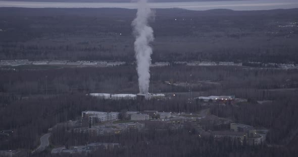 Helicopter aerial shot rotating around cellphone tower on Hollywood Hills, sunset alt