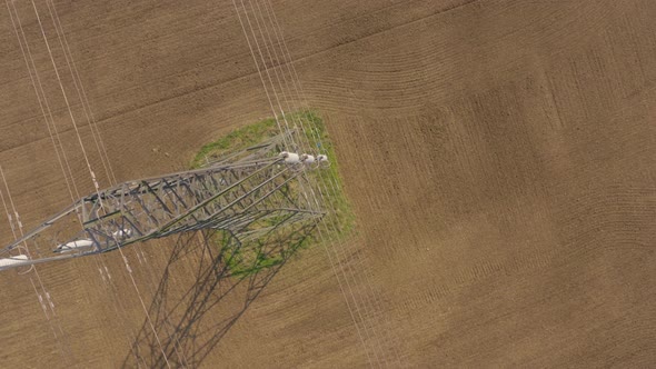 High Voltage Electrical Transmission Pylon Close Up Aerial View alt