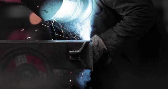 Welder Welding Joint Of A Metal Bar In A Steel Factory