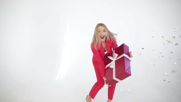 Funny Woman in Suit Catching Christmas Gift.