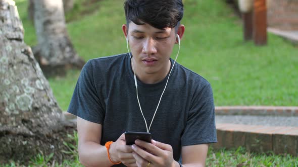 Man Listening To Music From Phone alt