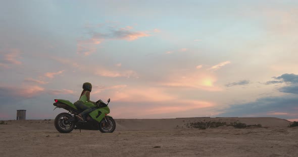 Cool Woman in Helmet on Motorbike on Beach