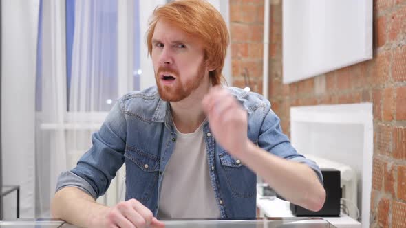 Young Handsome Redhead Beard Man Listening Secret Indoor alt