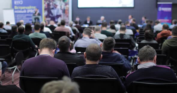 The Audience is Listening to the Lecturer in the Conference Hall alt