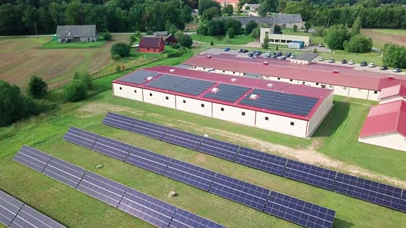 Solar panels on roof and yard at small factory (approx. 700 panels with 250 kW power) alt