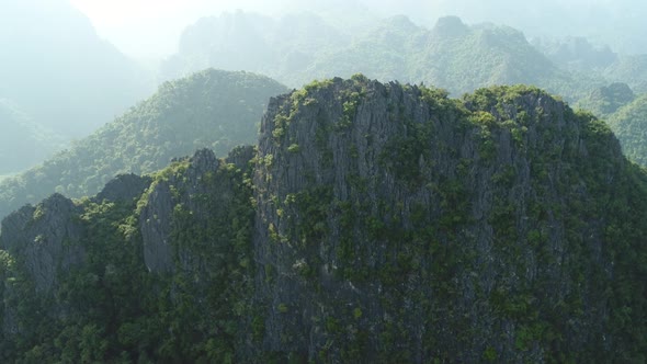 Landscape around the city of Vang Vieng in Laos seen from the sky alt