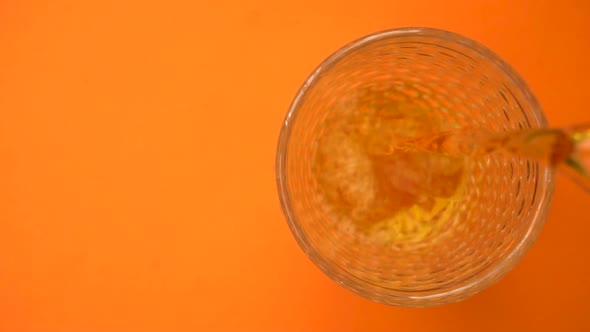 Pouring Apple or Grape Light Fresh Juice in the Glass