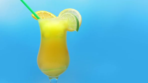 Delicious Exotic Cocktail Drink With Fruit Slices alt