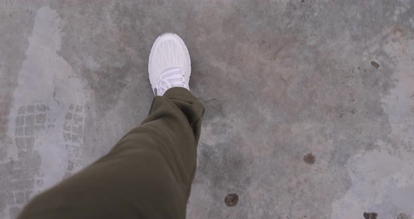 POV Male Legs in White Sneakers Going on a Ground alt