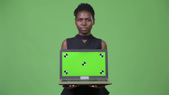 Young Beautiful African Businesswoman Showing Laptop