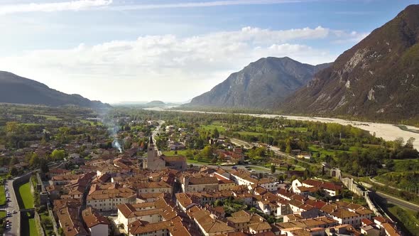 Aerial view of a small historic town Venzone in Northern Italy with red tiled roofs of old buildings alt