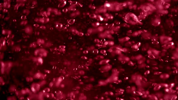 Full-Frame Red Sparkling Soda Lemonade Rising Carbonated Gas Bubbles Loop Background