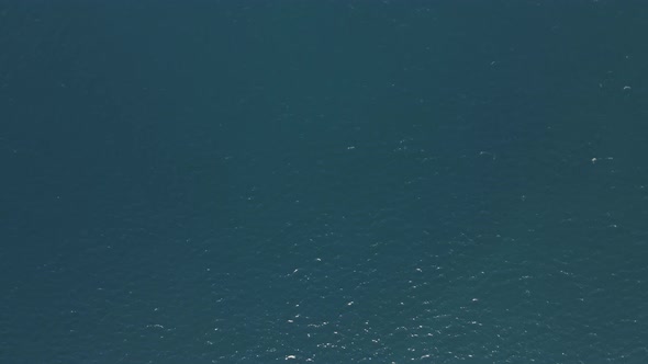 Aerial view of a motorboat along the coast, Elba Island, Italy. alt