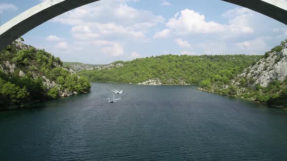Aerial view of famous place in Croatia. Drone flying under the bridge in mediterranean country