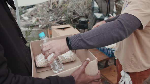 Giving Food to Homeless People at Tent City alt