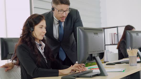 Business People Wearing Headset Working in Office alt