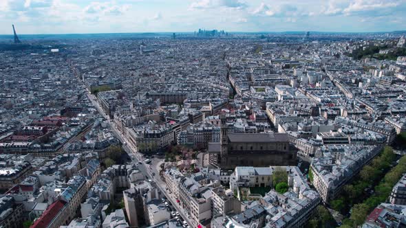Saint-Vincent de Paul Catholic Church And Gare du Nord Transit station In Paris, France. - aerial alt