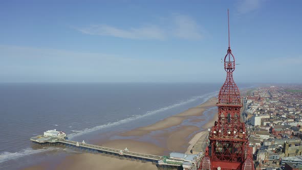 Aerial footage, drone view , of the famous Blackpool Tower and beach from the sky on a beautiful Sum alt