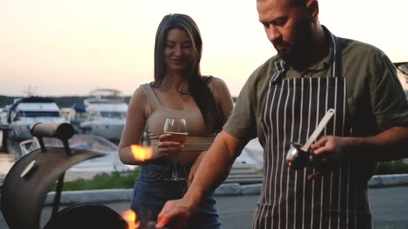 Juicy grilled meat steak.  man treats a woman with cooked meat.