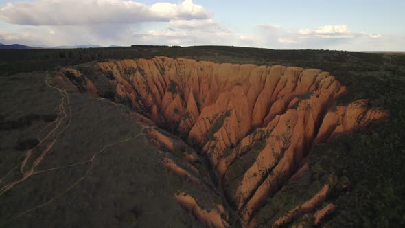 Drone Flight over Cárcavas desert limestone sand rocks formation at sunset, Spain. alt