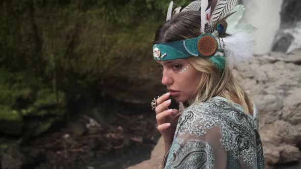 Nicelooking Sensual Model Posing Close to the Waterfall in Rocks alt