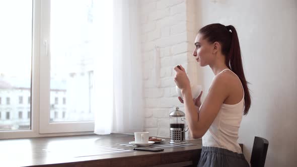 Woman Having Breakfast At Home, Enjoying Food In Morning alt