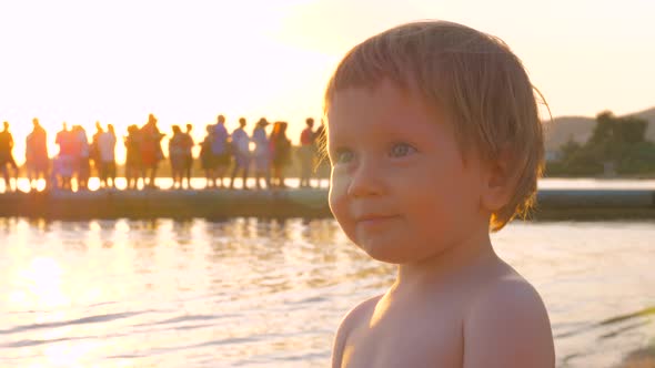 Lovely Blue-eyed Girl Smiling and Looking with Trust on Somebody. Children Psychology: Love alt