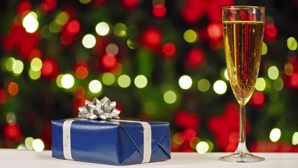 Happy New Year! Traditional New Year's Ritual with Champagne and Gifts alt