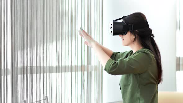 Medium Shot Woman Gamer Wearing Modern Virtual Reality Glasses Making Gesture Waving Hands alt