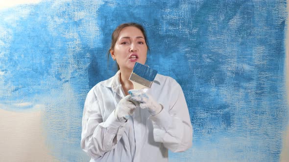 Designer Lady in Shirt Dances Singing Into Paintbrush As Mic alt