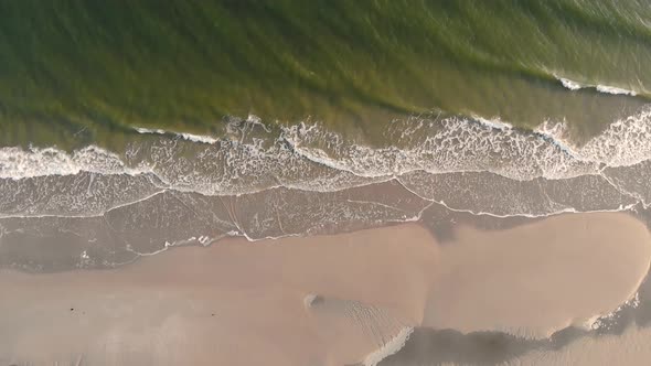 Aerial view overlooking a calm water at a Ostende Beach, on Langeoog island alt