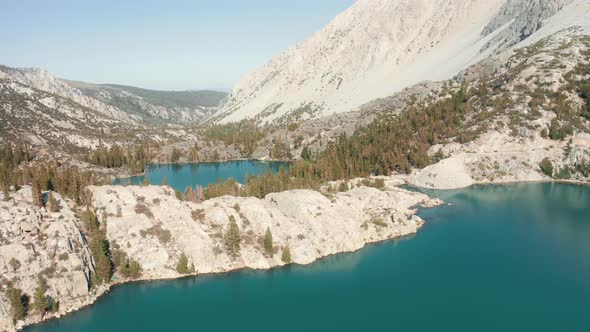 Aerial View of Still Blue Water Surface in Glacier Lake in the Sierra Nevada alt