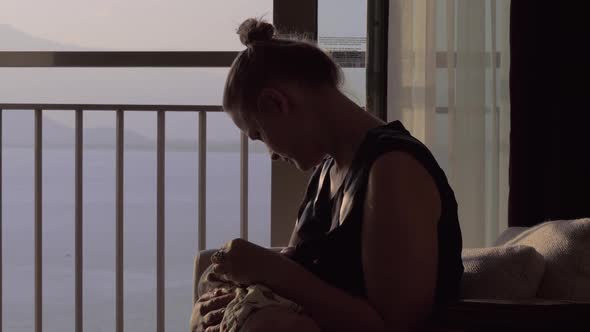 Mother Nursing Baby at Home alt