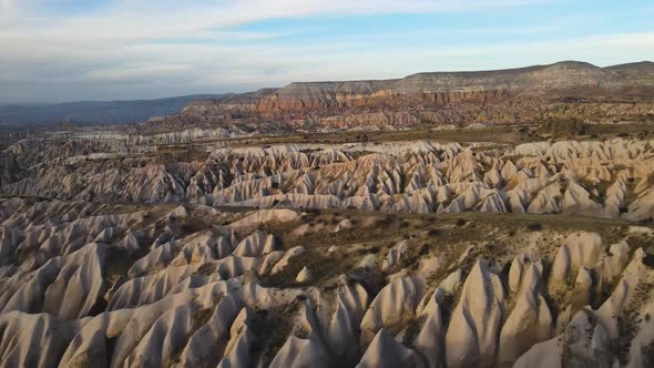 Cappadocia Aerial Drone or Balloon View to Red and Rose Valley Rock Formation Ancient Cave Churches alt
