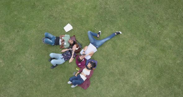 Teenage students using smartphone