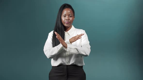 A Young Beautiful Woman is Gesturing and Looking at the Camera alt
